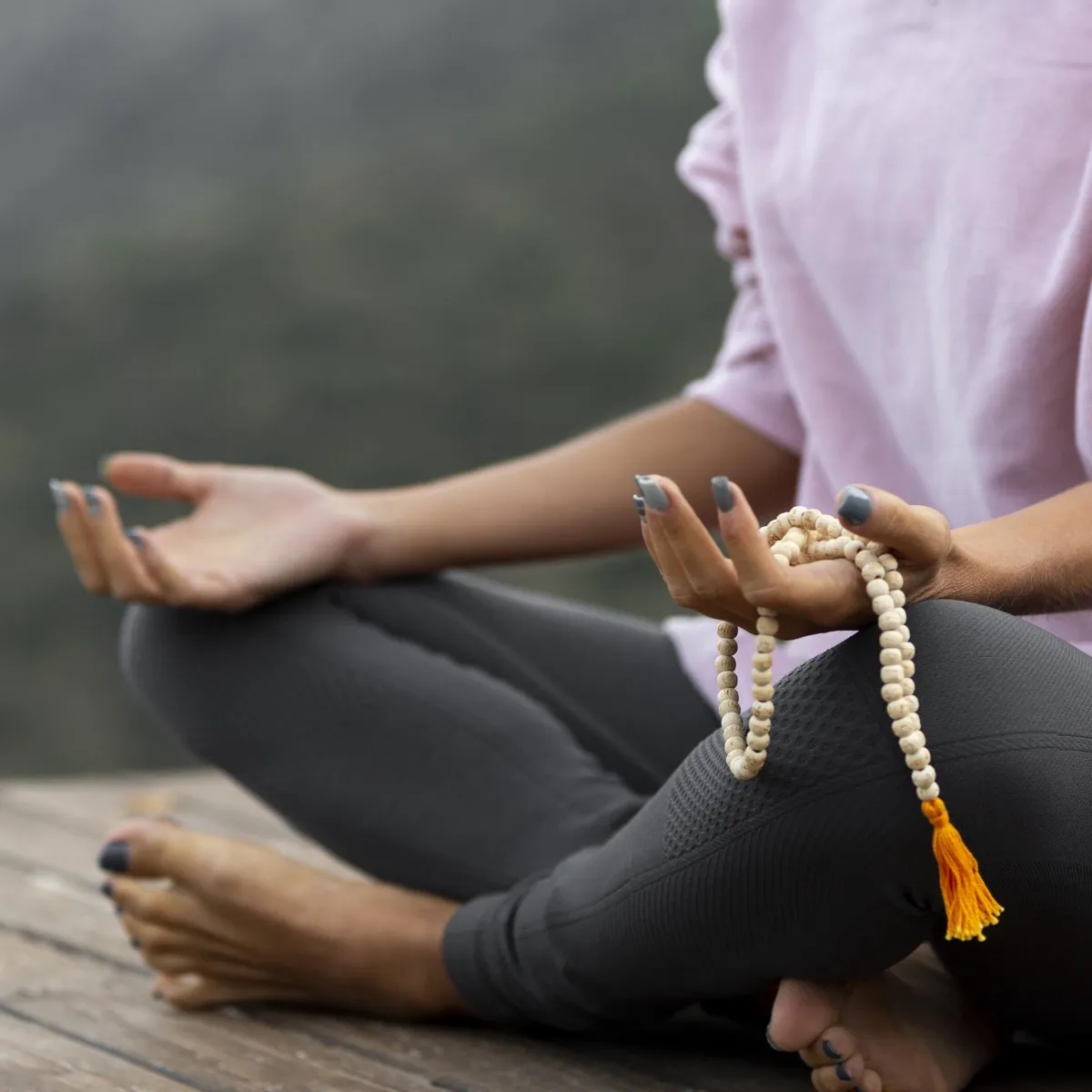 Woman meditating with rosary